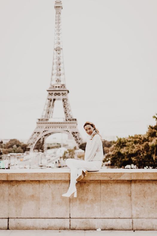 Matching white heeled boots in front of the Eiffel